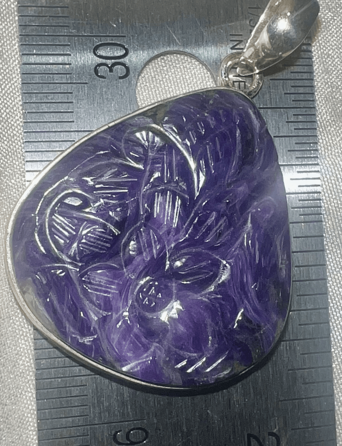 Dream Weaver: Carved Charoite and Silver Pendant"